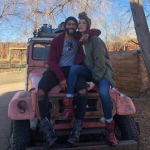 Caption: Jennifer Pfautch and her husband with their jeep