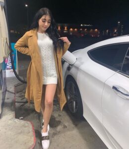 Caption: LifeBeingDest with her car